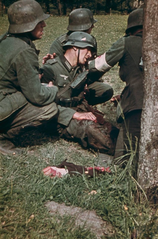 german_soldiers_comforting_wounded_comrade_who_has_just_had_his_arm_foreground_blown_off_in_the_bloody_east_front_fighting_1942.b3nzcly4p40gs4coo8cg0oo0s.ejcuplo1l0oo0sk8c40s8osc4.th.jpeg
